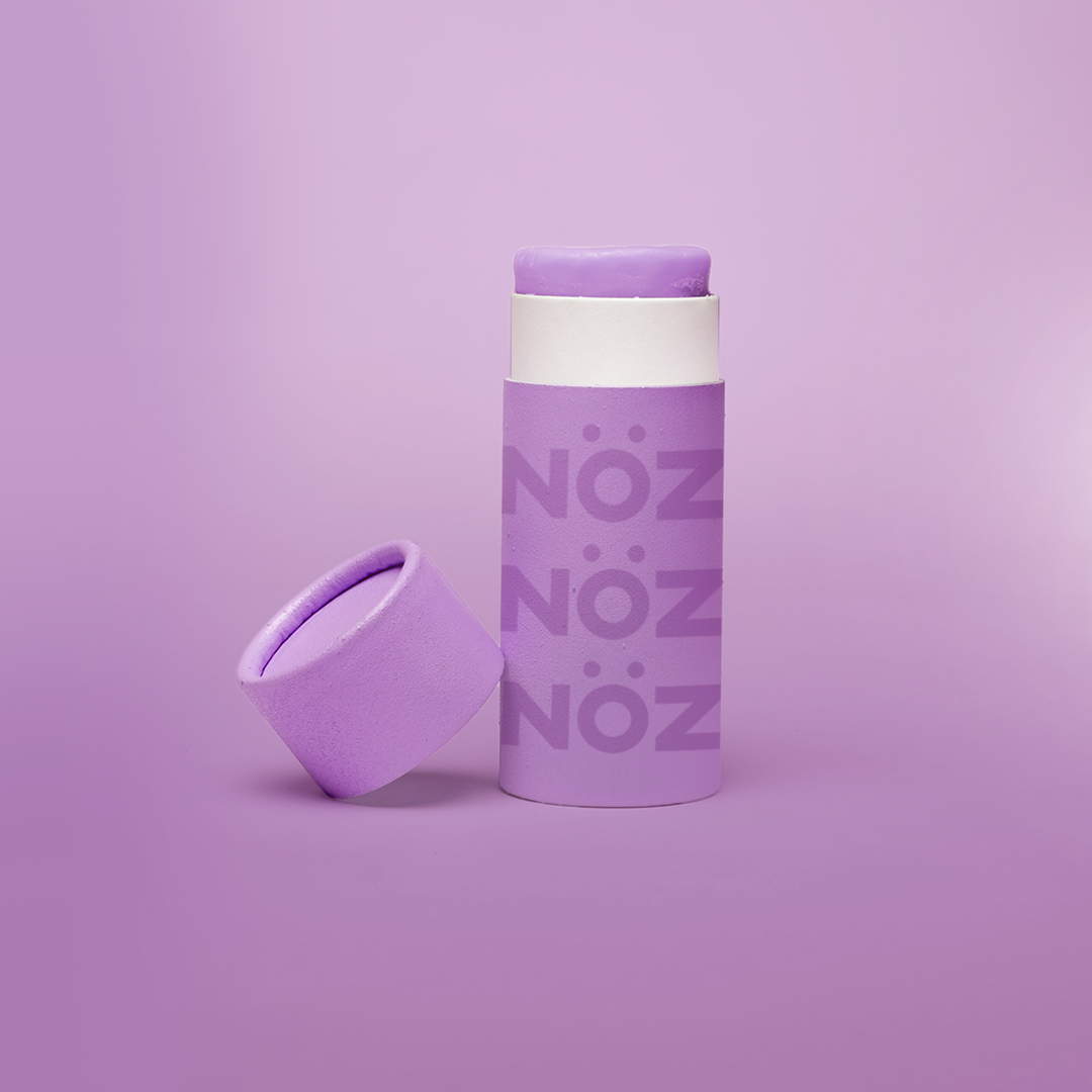 Purple color of Nöz nose sunscreen stick uncapped